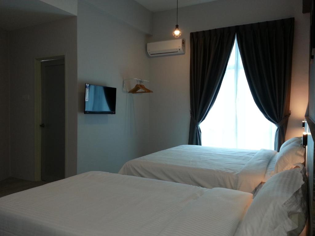 Postel nebo postele na pokoji v ubytování L Hotel