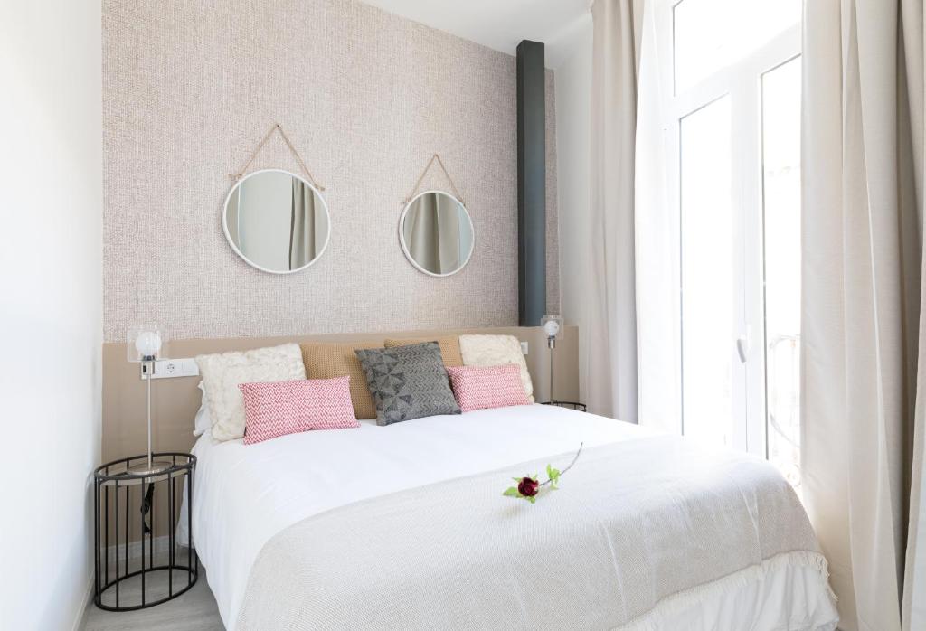 Posteľ alebo postele v izbe v ubytovaní Apartamentos Soho Boutique Museo