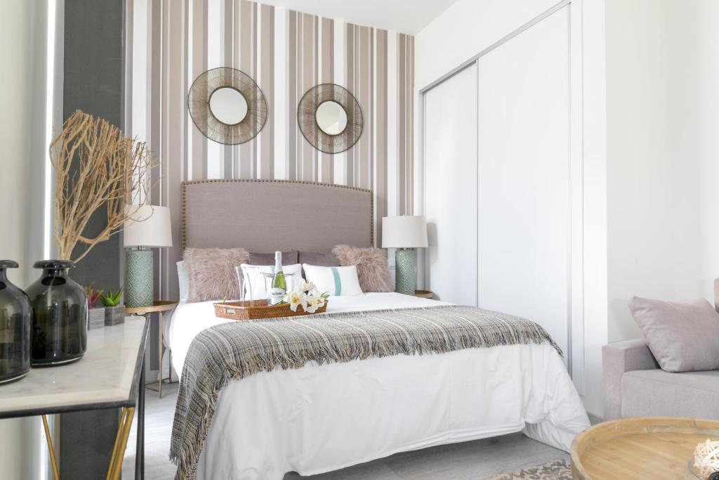 Posteľ alebo postele v izbe v ubytovaní Apartamentos Soho Boutique Museo