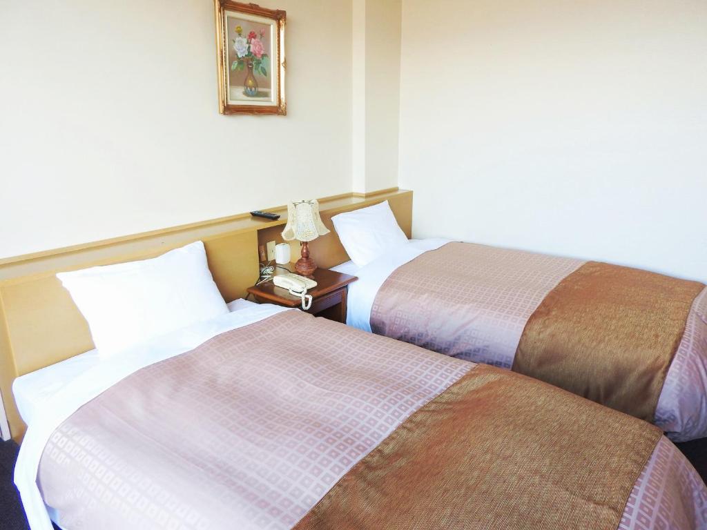 Postel nebo postele na pokoji v ubytování Kai Resort Hotel