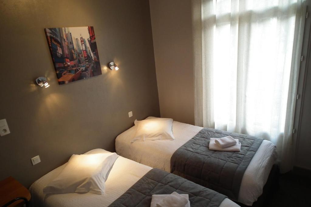 Postel nebo postele na pokoji v ubytování Hôtel de l'Aviation