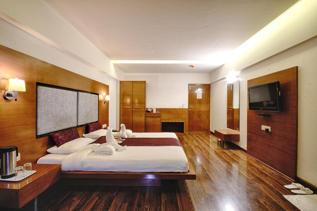 Postel nebo postele na pokoji v ubytování Hotel Platinum Residency