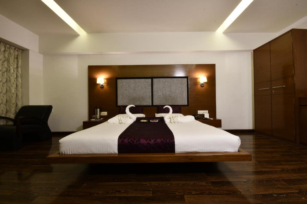 Postel nebo postele na pokoji v ubytování Hotel Platinum Residency