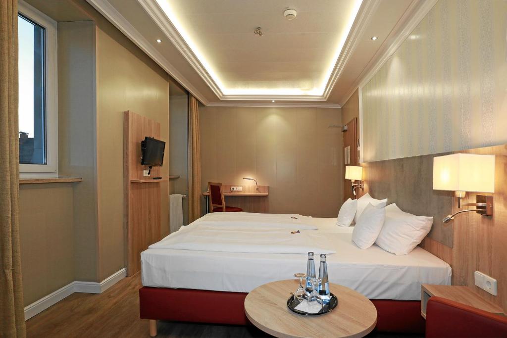Postel nebo postele na pokoji v ubytování Hotel Danner