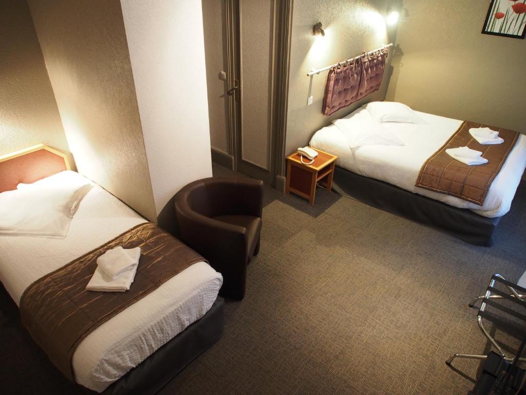Postel nebo postele na pokoji v ubytování Hôtel de l'Aviation