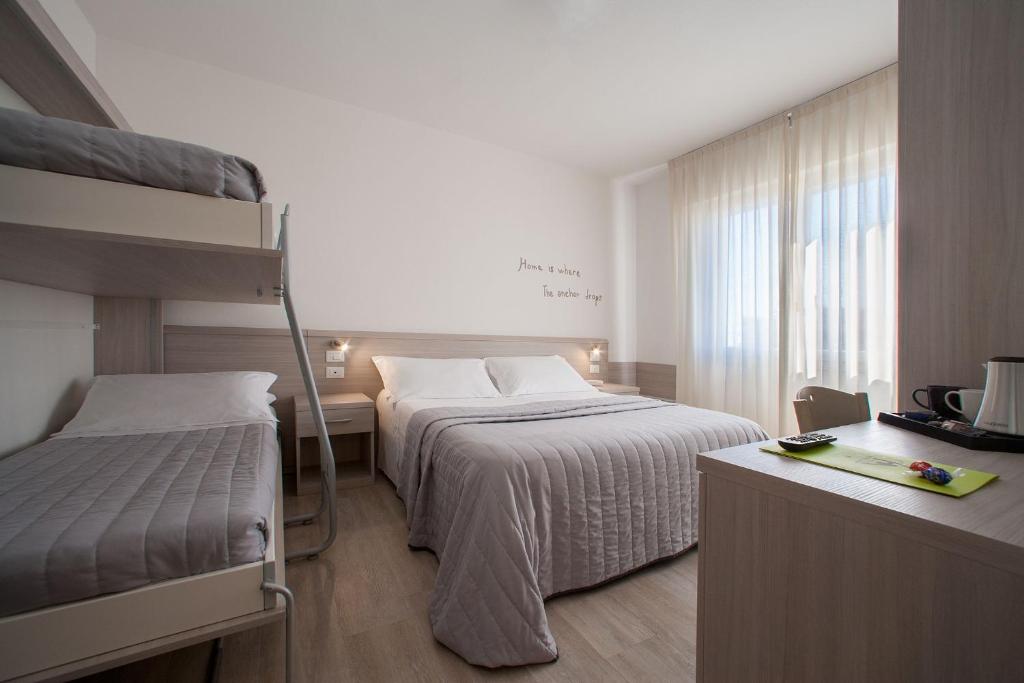 Postel nebo postele na pokoji v ubytování Hotel Anny