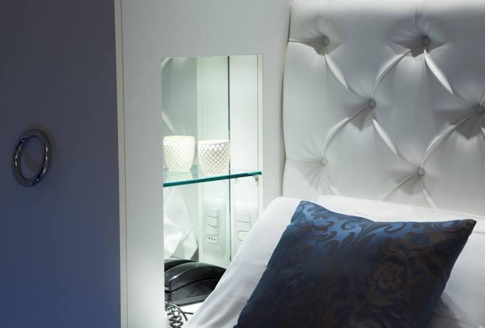 Postel nebo postele na pokoji v ubytování Hotel Ambassador