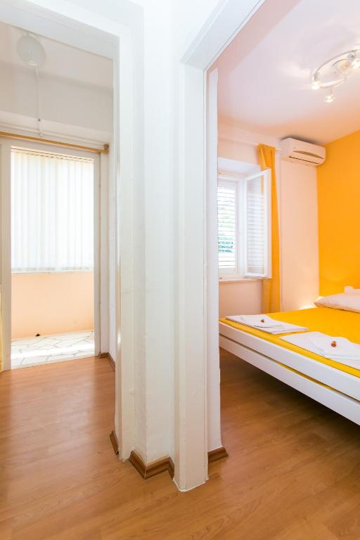 Posteľ alebo postele v izbe v ubytovaní Yellow Room Guesthouse