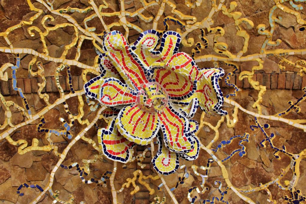 a painting of a flower on a wall at Villa Ana Margarida Beach in Ericeira