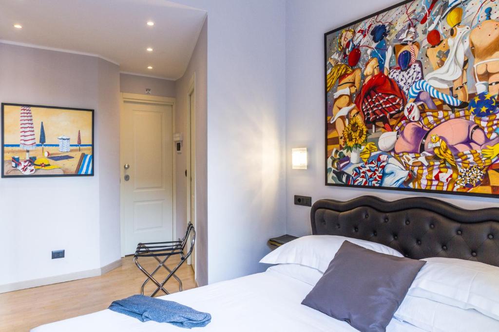 Postel nebo postele na pokoji v ubytování Aiello Rooms