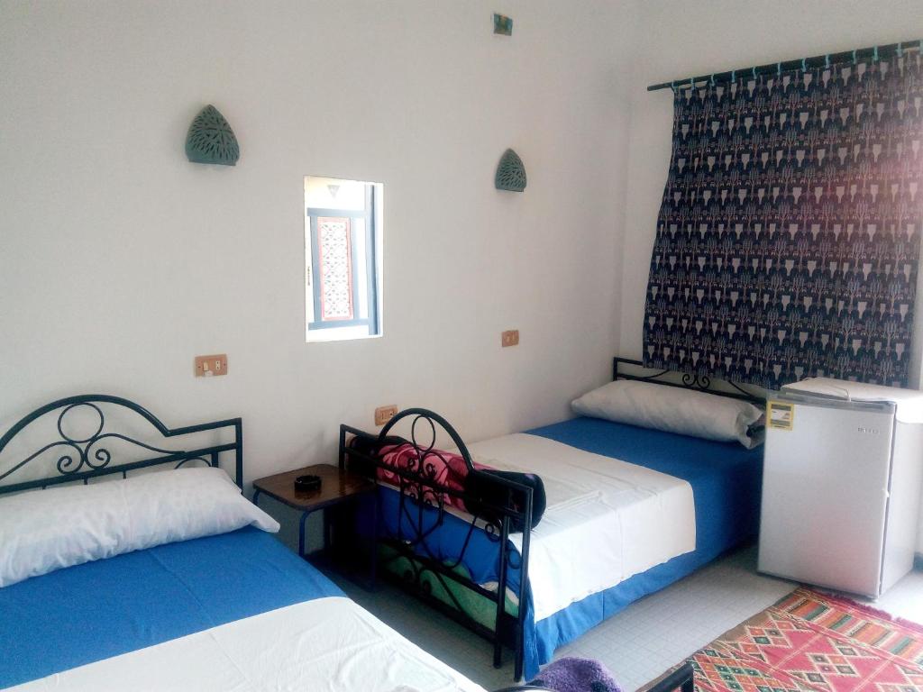 Postel nebo postele na pokoji v ubytování Monica Hotel