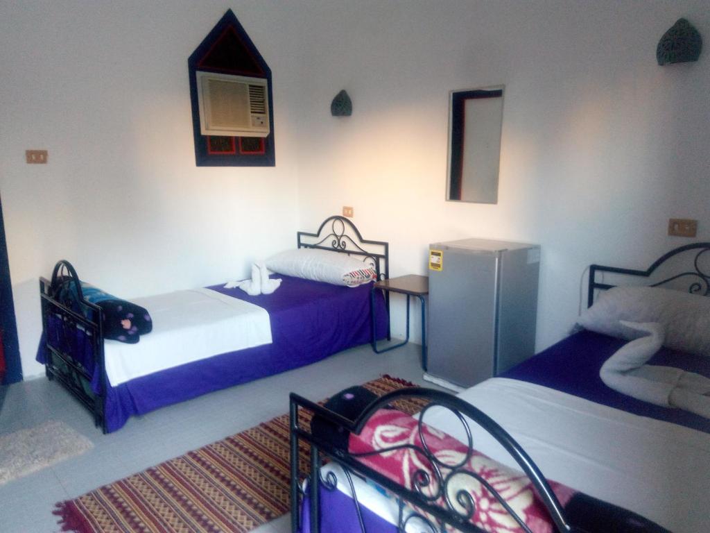 Postel nebo postele na pokoji v ubytování Monica Hotel