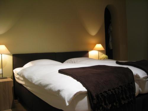 Postel nebo postele na pokoji v ubytování B&B 't Wit Huys Brugge