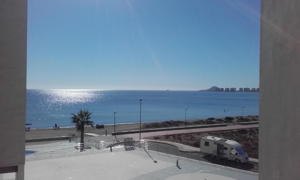 a view of the ocean from a building with a camper at Meandyou Marazul Lamanga in La Manga del Mar Menor