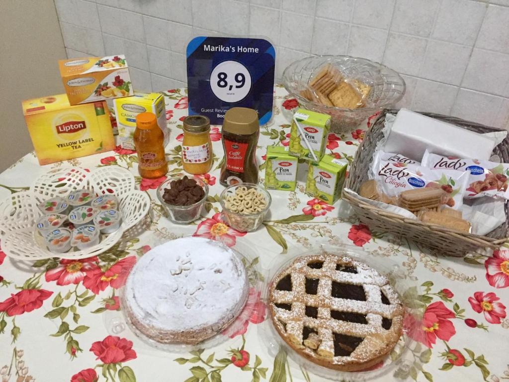 a table with food and other food items on it at Marika's Home in Moneglia