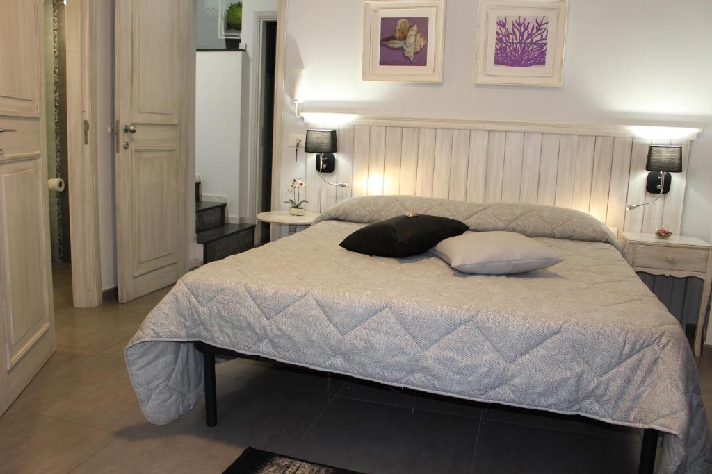 Postel nebo postele na pokoji v ubytování Bed & Breakfasts Conte Perollo