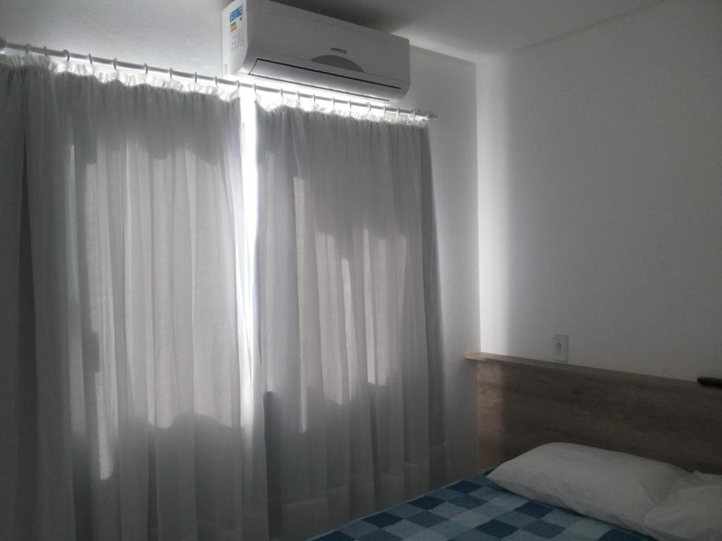 Postel nebo postele na pokoji v ubytování Residencial Neto