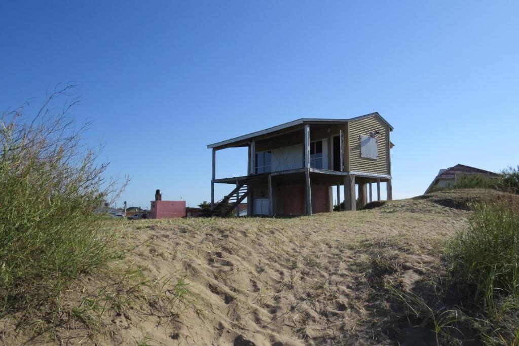 a house on top of a hill on a beach at Playa Grande Frente al Mar in San Clemente del Tuyú