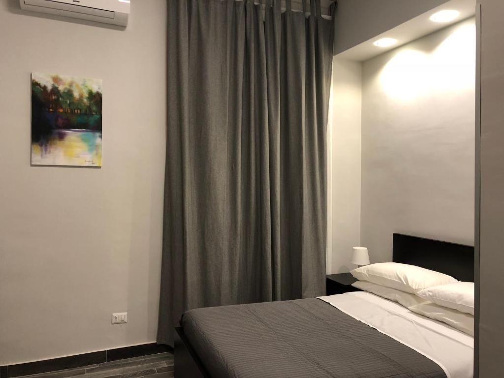 Postel nebo postele na pokoji v ubytování Caio Duilio B&B