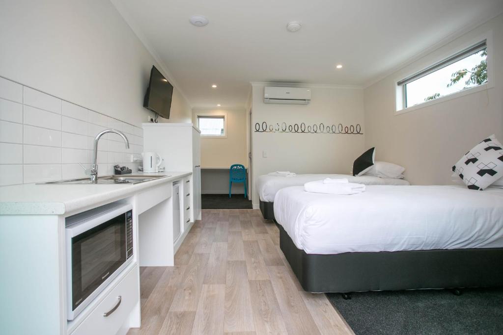 Postel nebo postele na pokoji v ubytování Podium Lodge