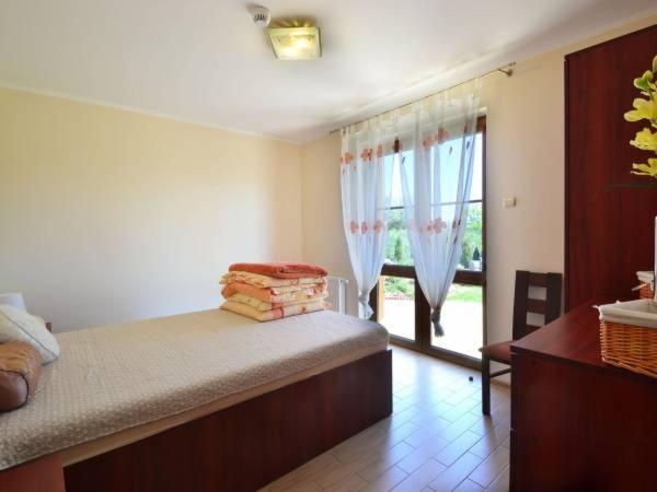 Giường trong phòng chung tại Villa Marcus