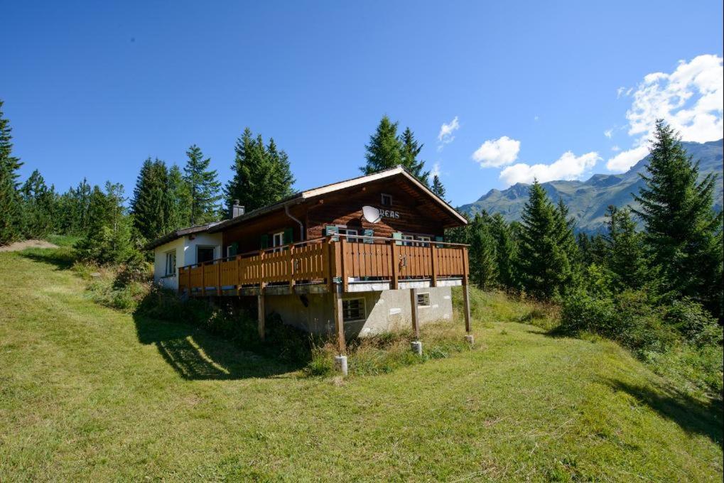 a house on a hill in a field at Oreas (724 Du) in Valbella