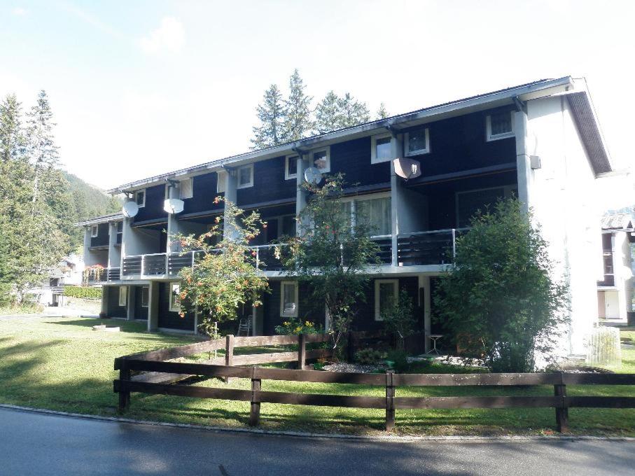 a large building with a fence in front of it at Las Bargias 12 (407 Ho) in Lenzerheide