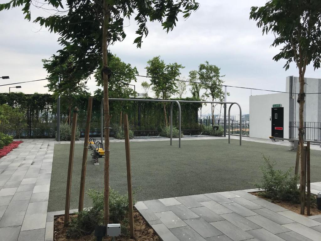 a park with a playground with trees in it at CBD3 SOHO in Cyberjaya