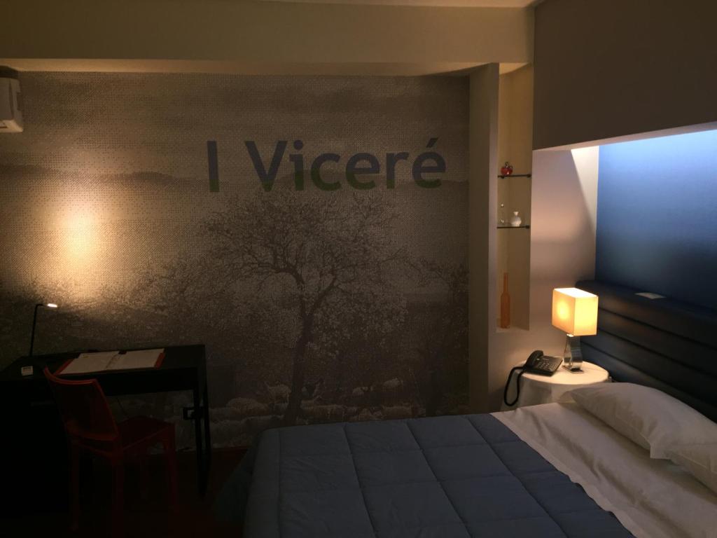 Postel nebo postele na pokoji v ubytování Mare Nostrum Petit Hôtel