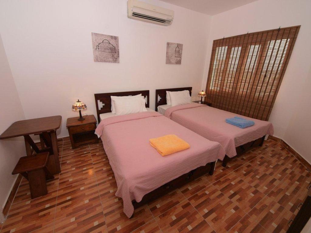 Postel nebo postele na pokoji v ubytování Lana Villa