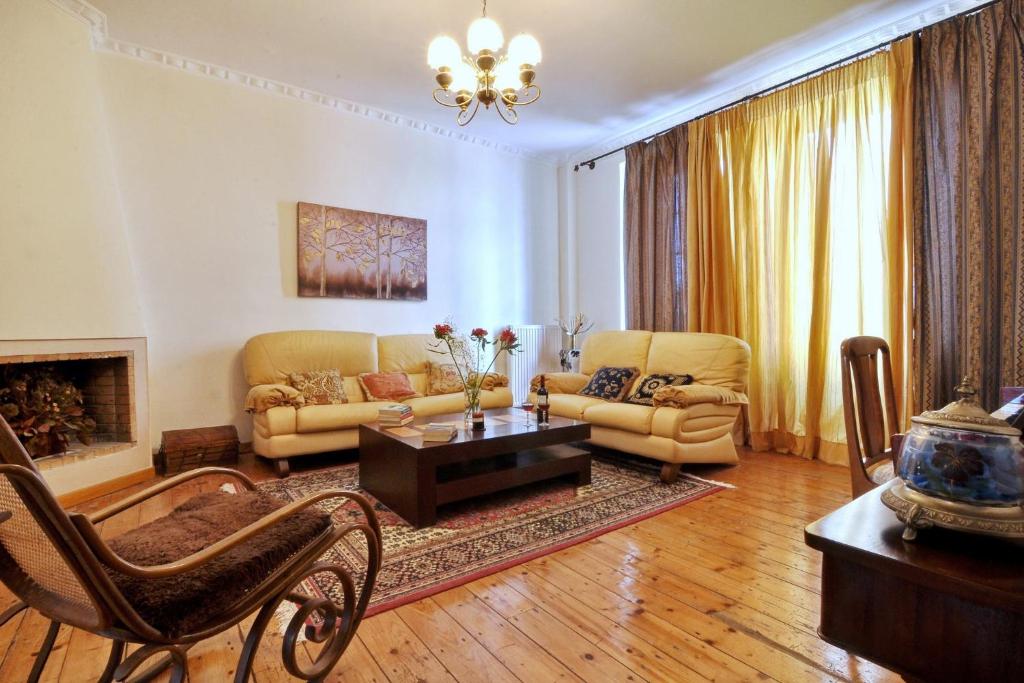 a living room with a couch and a coffee table at San Rocco Apartment in Corfu