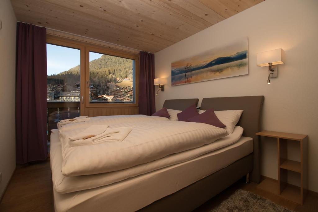 Postel nebo postele na pokoji v ubytování Chalet Belmont Penthouse