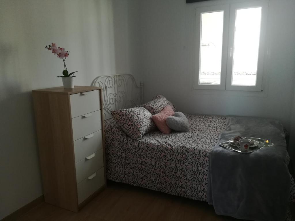 Postel nebo postele na pokoji v ubytování Bay Home