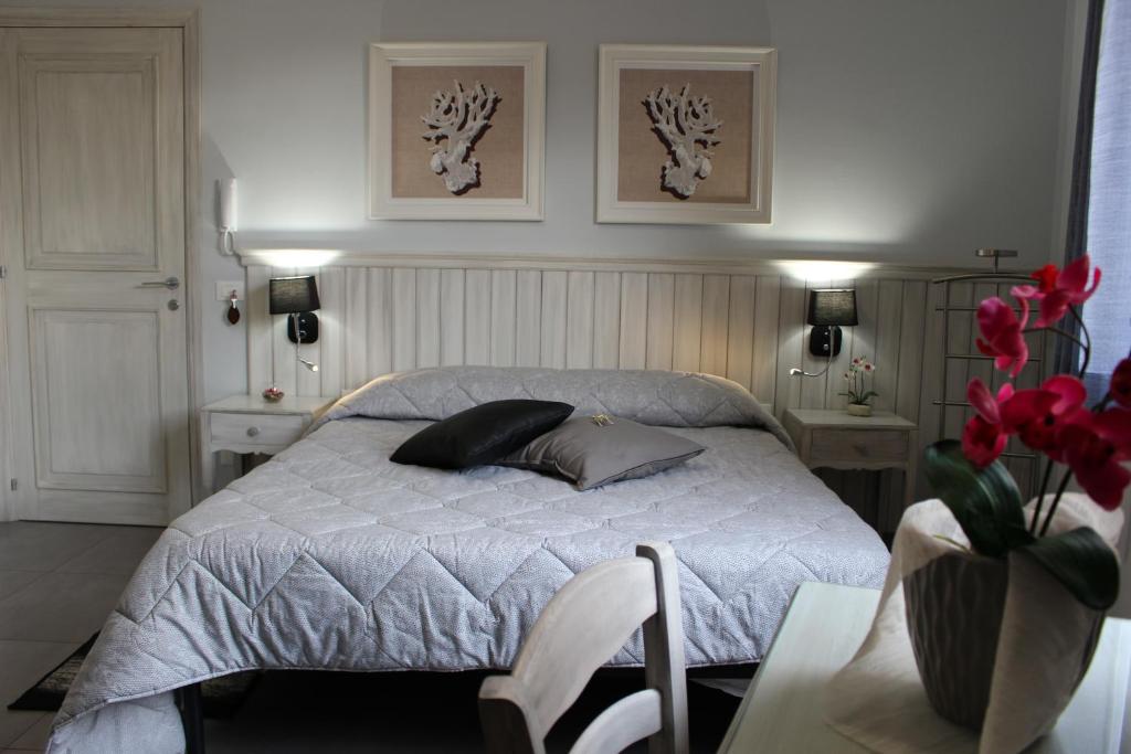 Postel nebo postele na pokoji v ubytování Bed & Breakfasts Conte Perollo