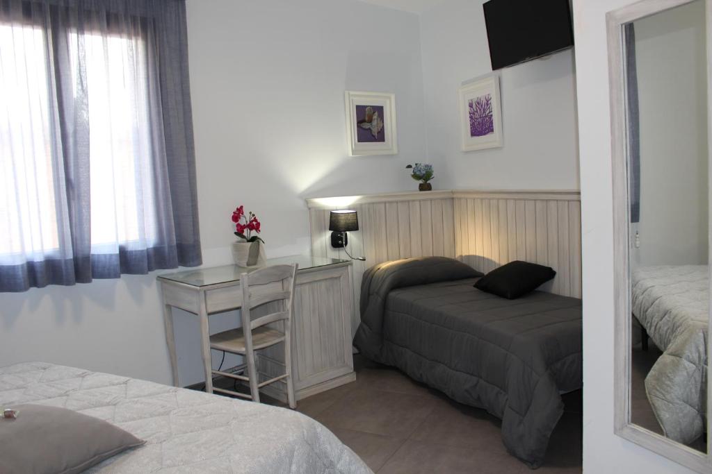 Postel nebo postele na pokoji v ubytování Bed & Breakfasts Conte Perollo