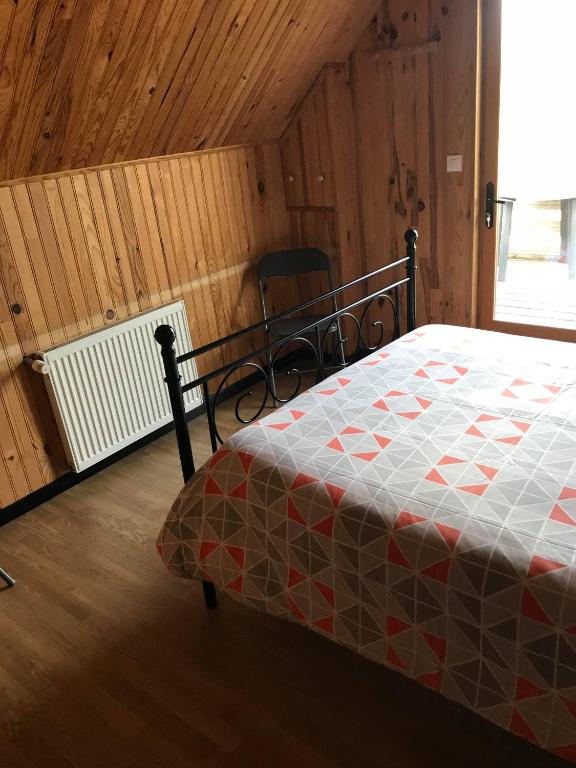 Postel nebo postele na pokoji v ubytování Le chant des oiseaux