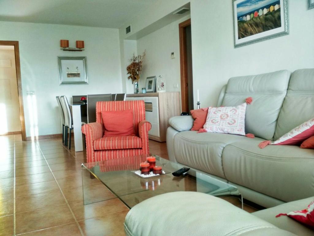 a living room with a couch and two chairs at Gran Plaza in Roquetas de Mar