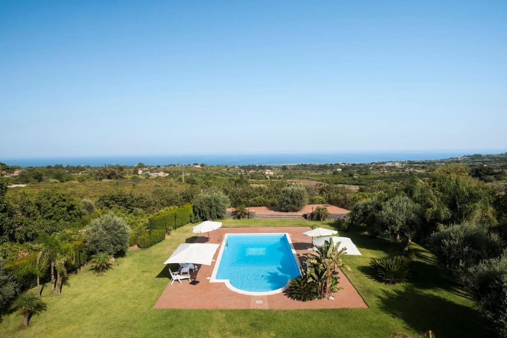 an aerial view of a villa with a swimming pool at Villa Ginevra in Santa Venerina