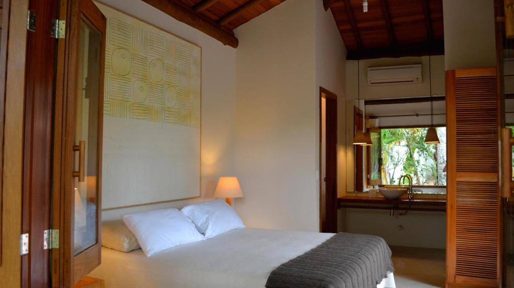 Postel nebo postele na pokoji v ubytování Camauí Hotel