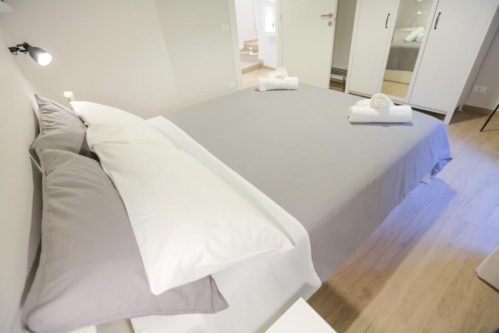 Łóżko lub łóżka w pokoju w obiekcie Casa sul mare