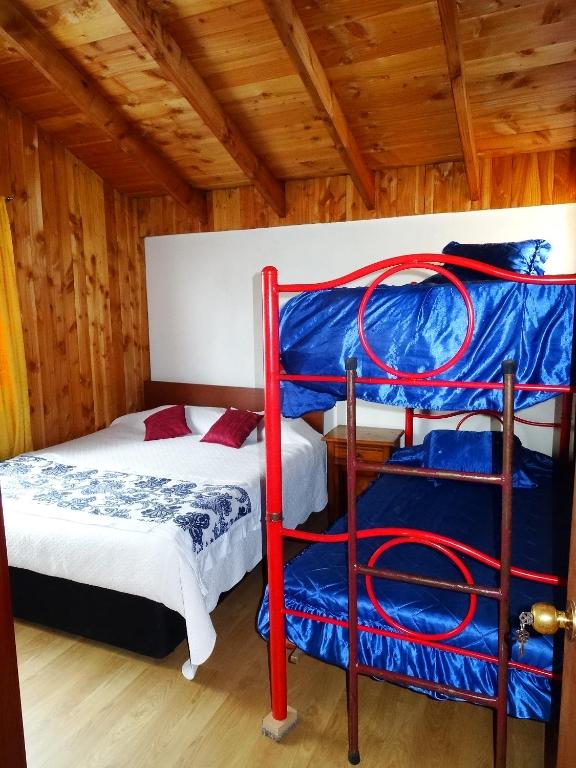 Postel nebo postele na pokoji v ubytování Hostal Maitahue