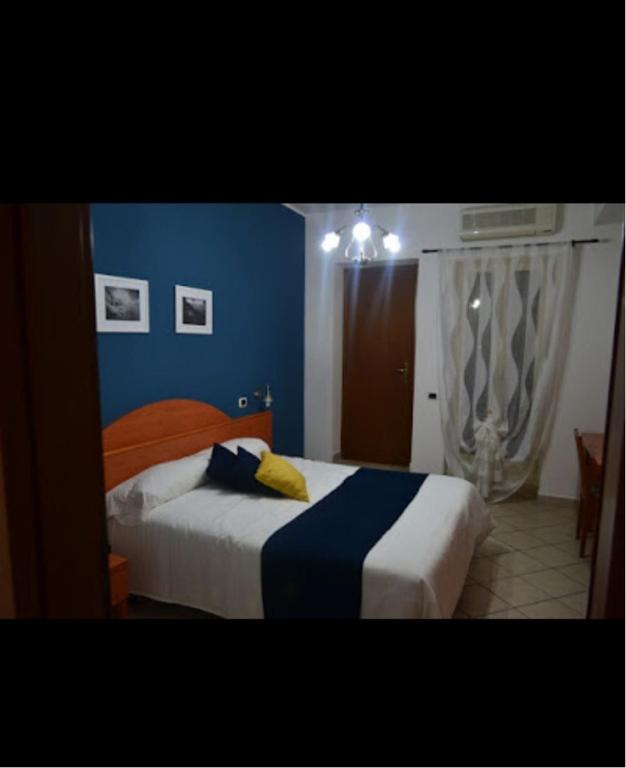 Кровать или кровати в номере Albergo Ristorante San Tommaso