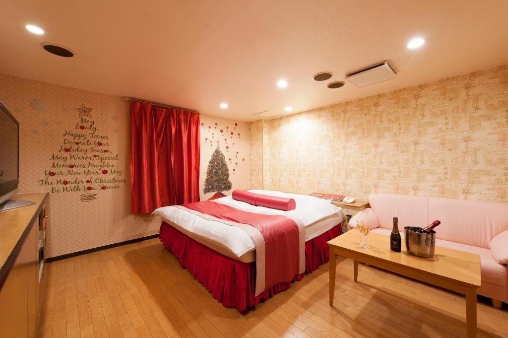 Postel nebo postele na pokoji v ubytování ホテル ブランチャペルクリスマス 四日市