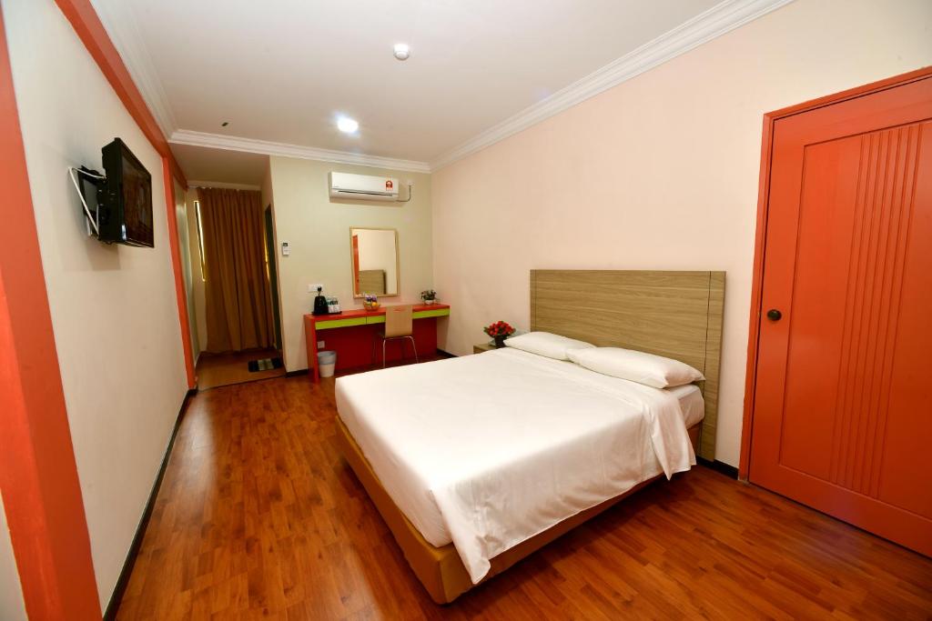 Postel nebo postele na pokoji v ubytování Classic Boutique Hotel Kuantan