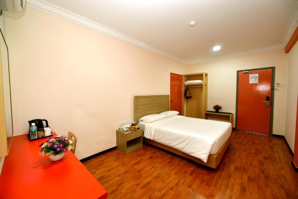 Postel nebo postele na pokoji v ubytování Classic Boutique Hotel Kuantan