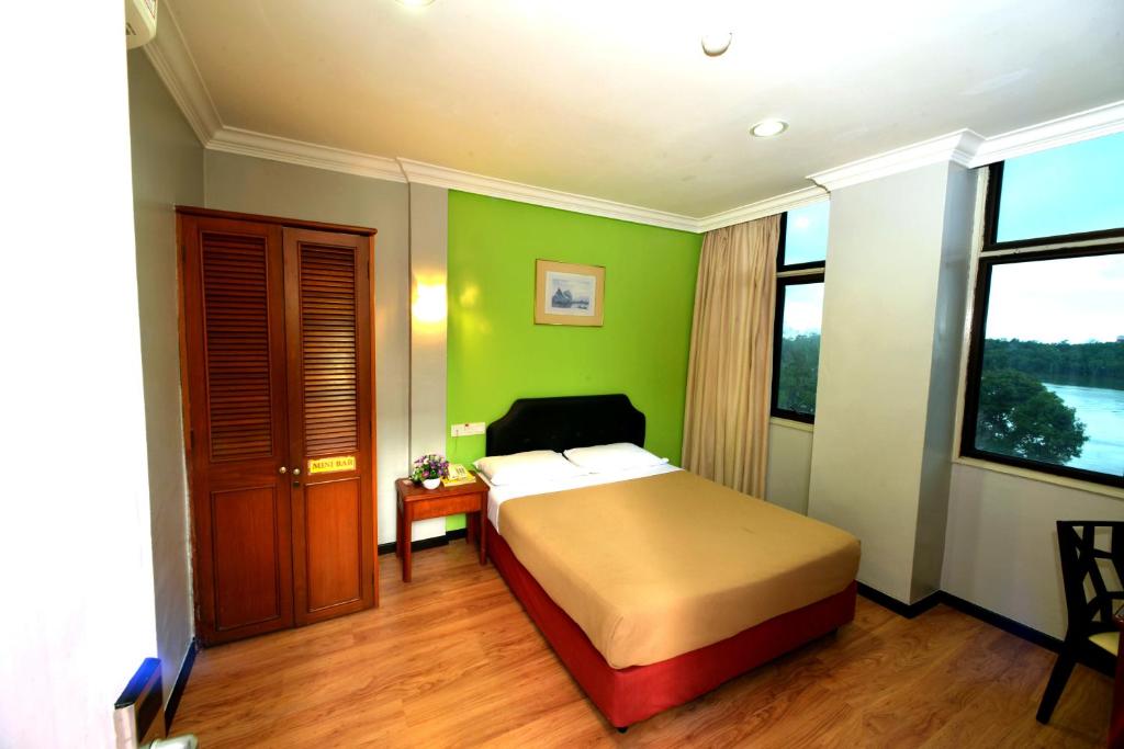 Postel nebo postele na pokoji v ubytování Classic Boutique Hotel Kuantan