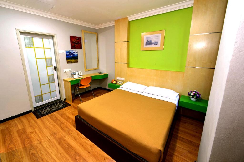 Postel nebo postele na pokoji v ubytování Classic Boutique Hotel Kuantan