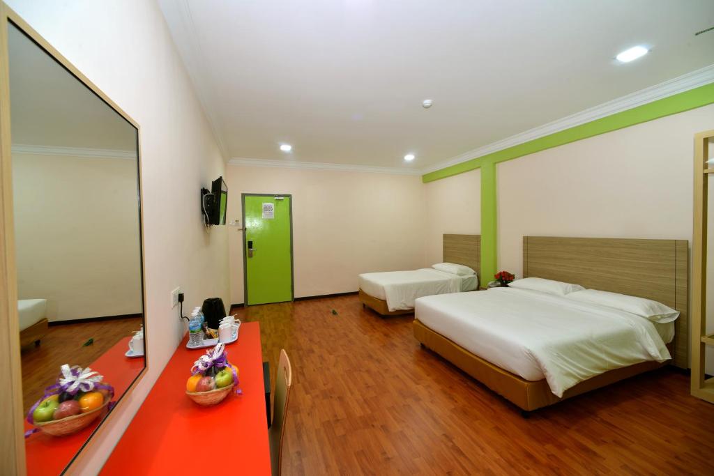 Postel nebo postele na pokoji v ubytování Classic Boutique Hotel Kuantan