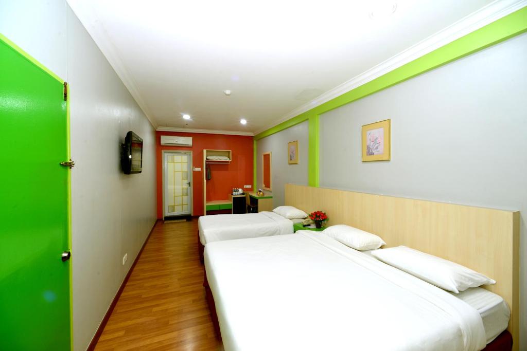 Postel nebo postele na pokoji v ubytování Classic Boutique Hotel Kuantan