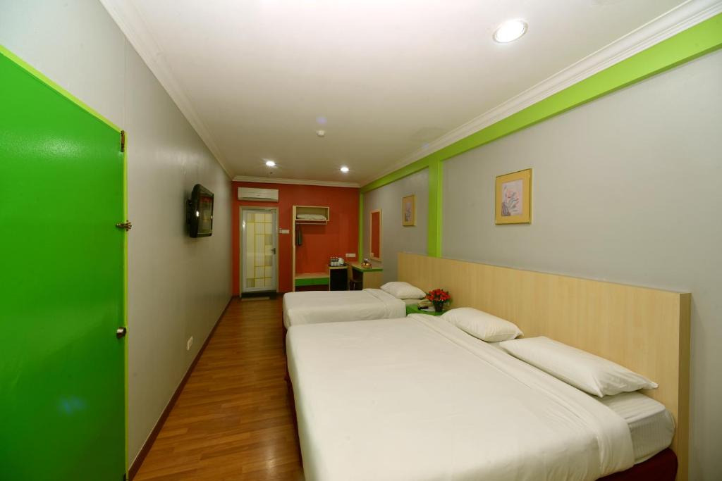 Postel nebo postele na pokoji v ubytování Classic Boutique Hotel Kuantan